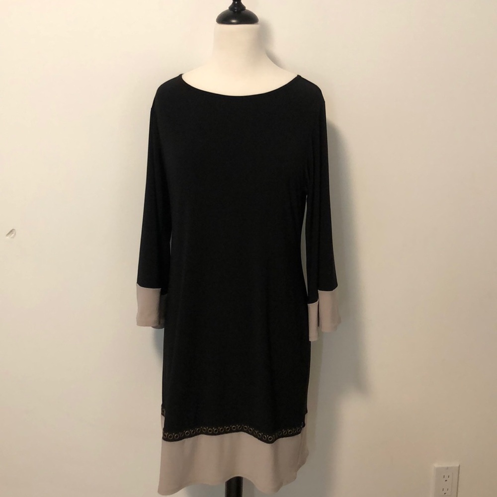 Very flattering Black Dress with detail bottom